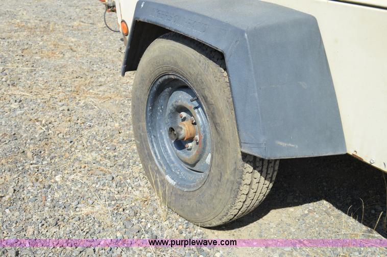 image for item F8338 2000 Ingersoll Rand 185 air compressor