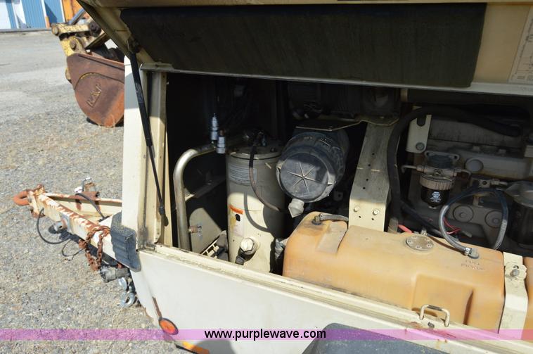 image for item F8338 2000 Ingersoll Rand 185 air compressor