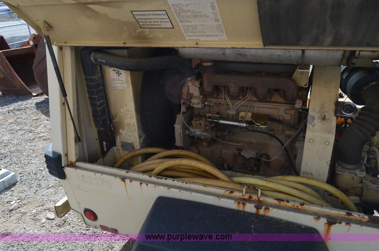 image for item F8338 2000 Ingersoll Rand 185 air compressor
