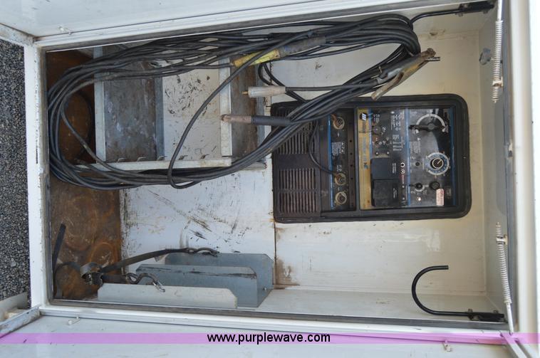 image for item F8345 2000 Freightliner FL70 service truck