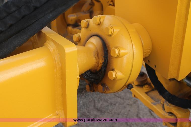 image for item H1714 1991 John Deere 670B articulated motor grader