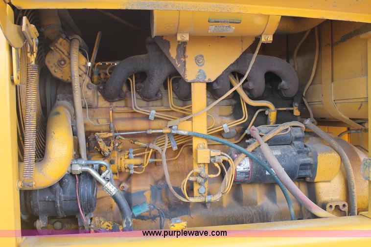 image for item H1714 1991 John Deere 670B articulated motor grader