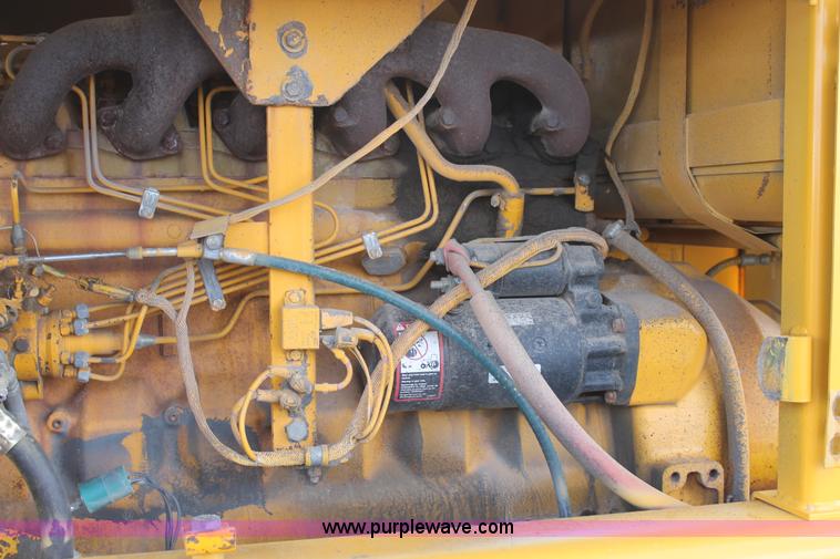 image for item H1714 1991 John Deere 670B articulated motor grader
