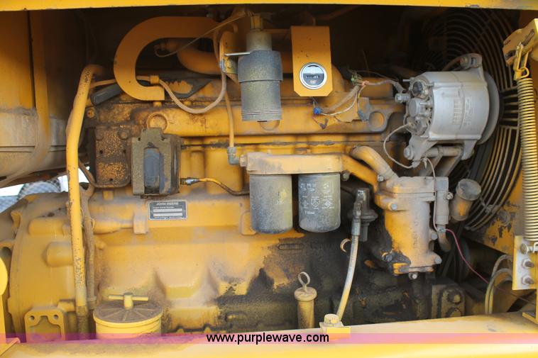 image for item H1714 1991 John Deere 670B articulated motor grader