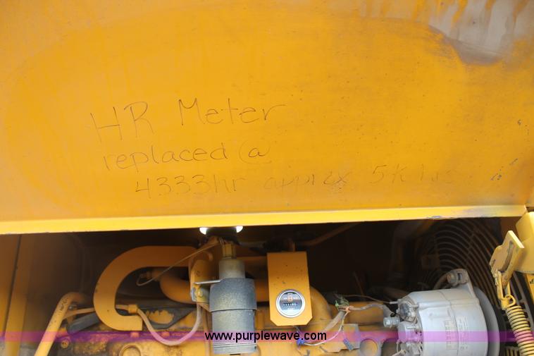 image for item H1714 1991 John Deere 670B articulated motor grader