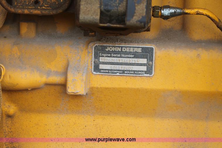 image for item H1714 1991 John Deere 670B articulated motor grader