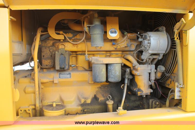 image for item H1714 1991 John Deere 670B articulated motor grader