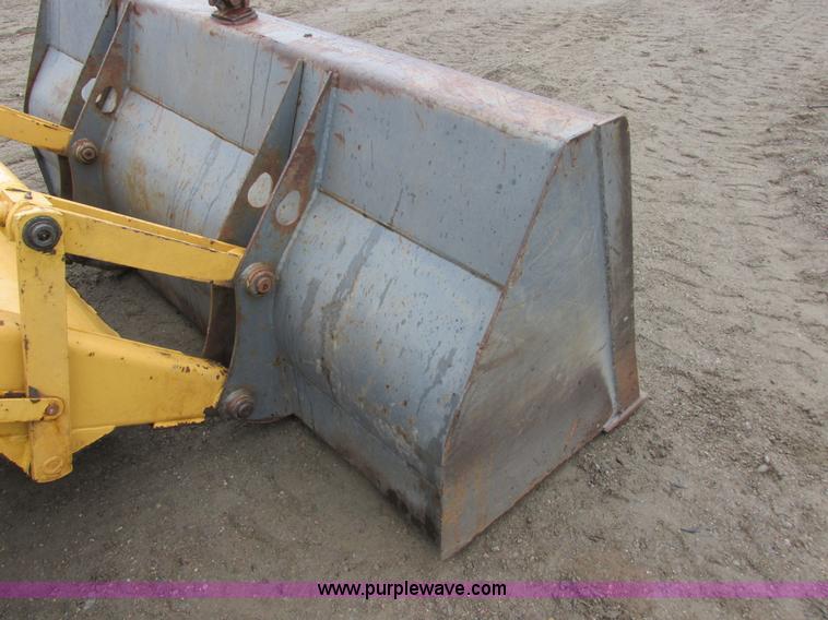 image for item I6033 1999 New Holland 655E backhoe