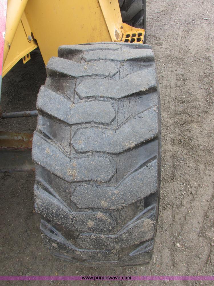 image for item I6033 1999 New Holland 655E backhoe