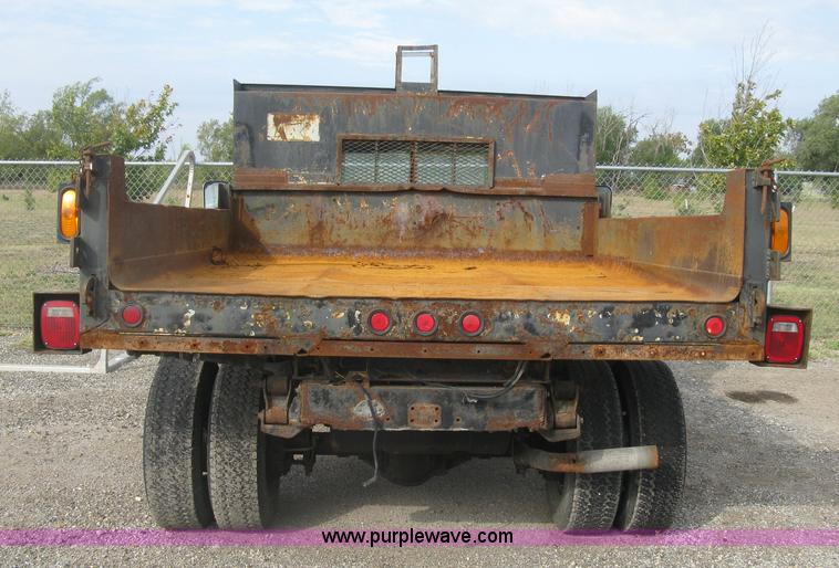 image for item E7996 1990 Ford F450 Super Duty dump flatbed truck