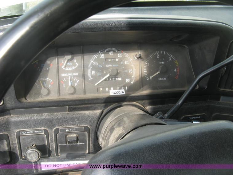 image for item E7996 1990 Ford F450 Super Duty dump flatbed truck