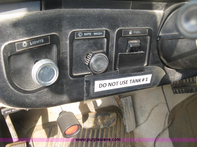 image for item E7996 1990 Ford F450 Super Duty dump flatbed truck