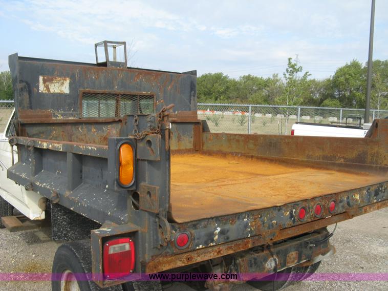 image for item E7996 1990 Ford F450 Super Duty dump flatbed truck