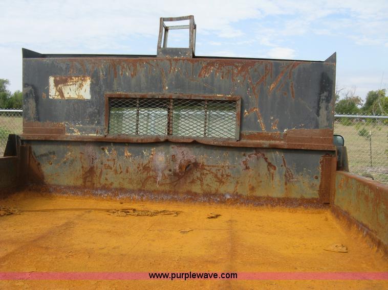 image for item E7996 1990 Ford F450 Super Duty dump flatbed truck