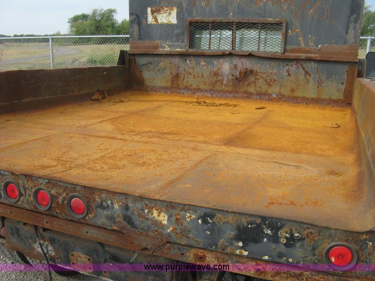 image for item E7996 1990 Ford F450 Super Duty dump flatbed truck