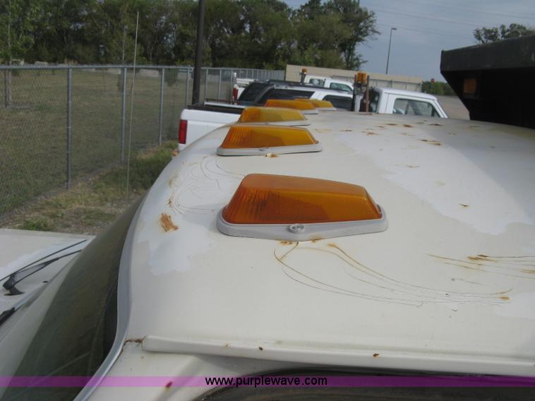 image for item E7996 1990 Ford F450 Super Duty dump flatbed truck