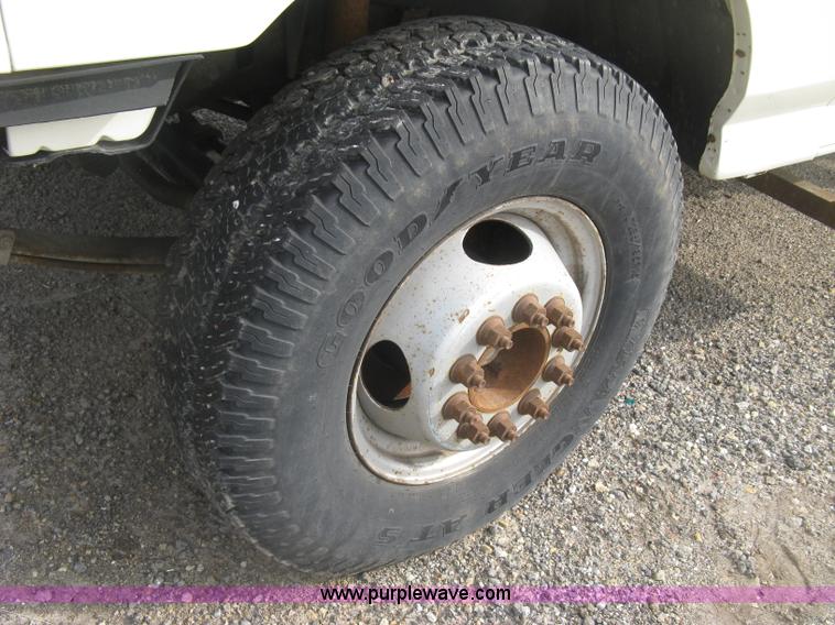 image for item E7996 1990 Ford F450 Super Duty dump flatbed truck