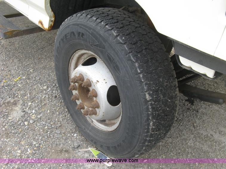 image for item E7996 1990 Ford F450 Super Duty dump flatbed truck