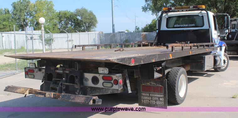 image for item J2244 2004 International DuraStar 4300 rollback truck