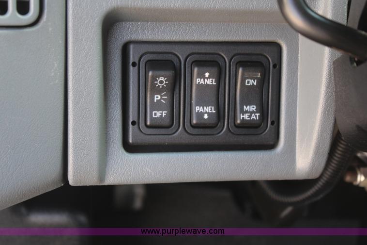 image for item J2244 2004 International DuraStar 4300 rollback truck