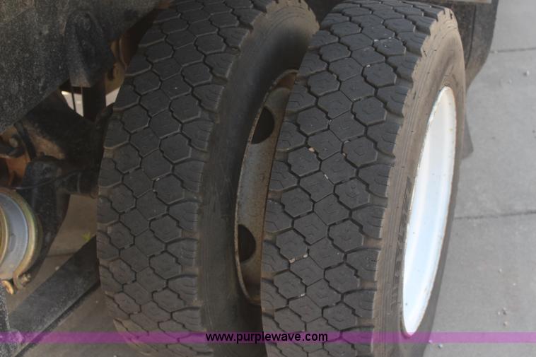 image for item J2244 2004 International DuraStar 4300 rollback truck