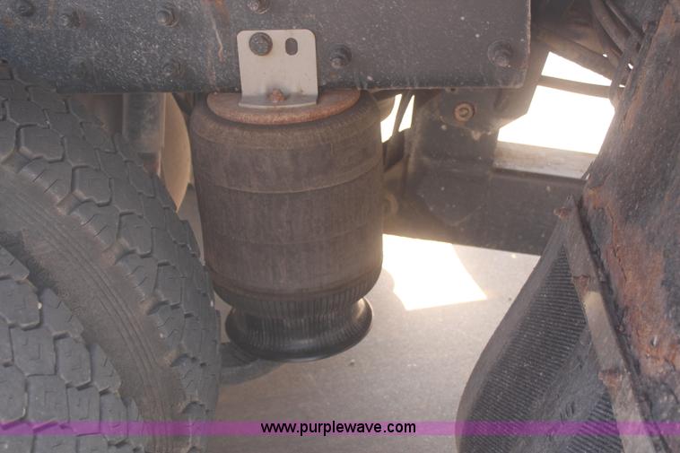 image for item J2244 2004 International DuraStar 4300 rollback truck