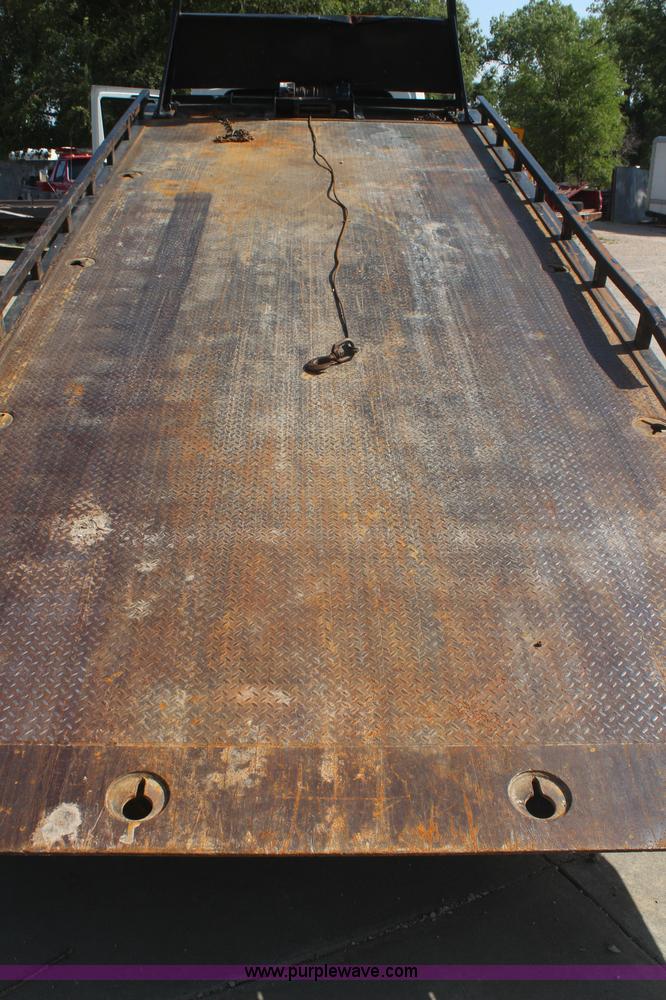 image for item J2244 2004 International DuraStar 4300 rollback truck