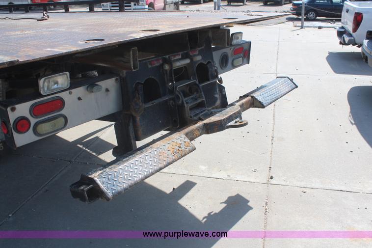 image for item J2244 2004 International DuraStar 4300 rollback truck