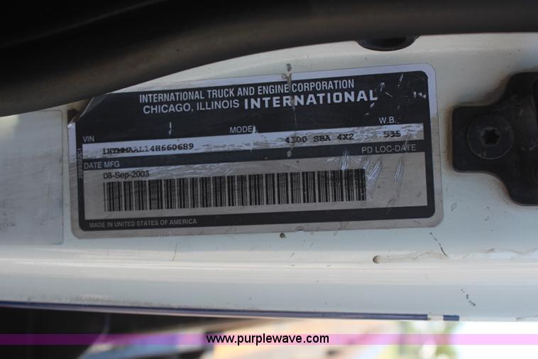 image for item J2244 2004 International DuraStar 4300 rollback truck