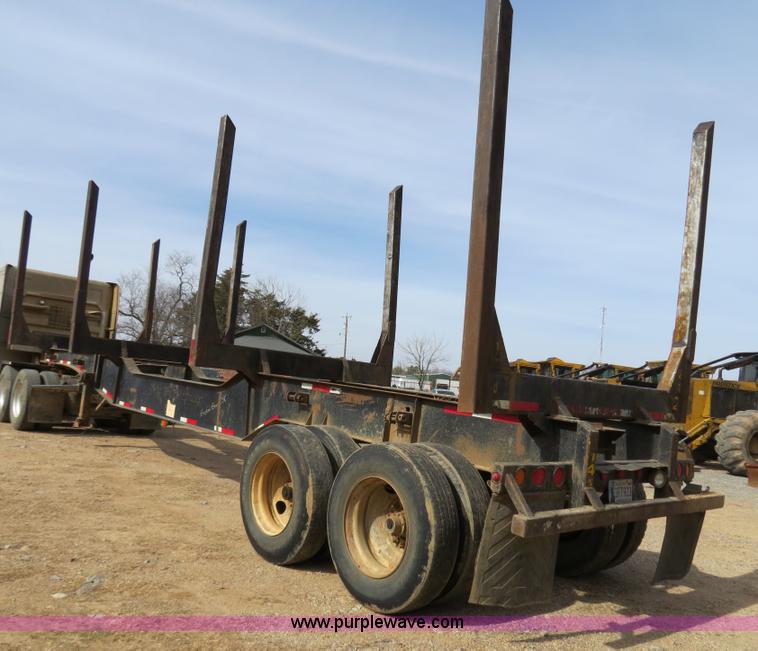 image for item B4848 2000 Sun Manufacturing, Inc. 4 Bolster Sun-Lite log trailer