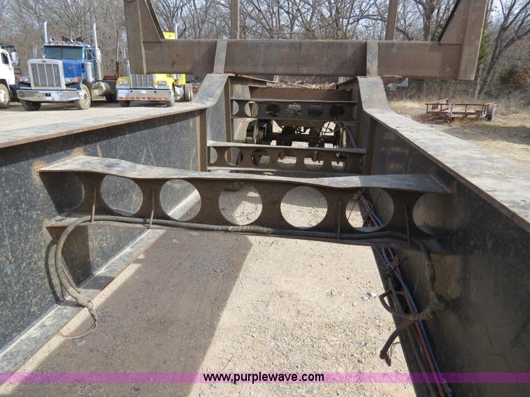 image for item B4848 2000 Sun Manufacturing, Inc. 4 Bolster Sun-Lite log trailer