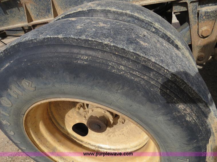 image for item B4848 2000 Sun Manufacturing, Inc. 4 Bolster Sun-Lite log trailer