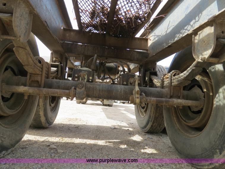 image for item B4848 2000 Sun Manufacturing, Inc. 4 Bolster Sun-Lite log trailer