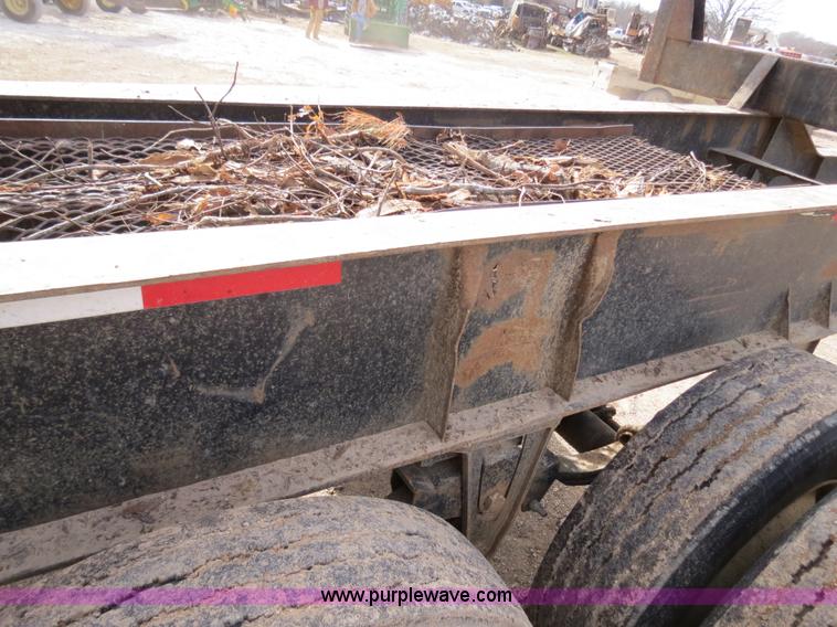 image for item B4848 2000 Sun Manufacturing, Inc. 4 Bolster Sun-Lite log trailer