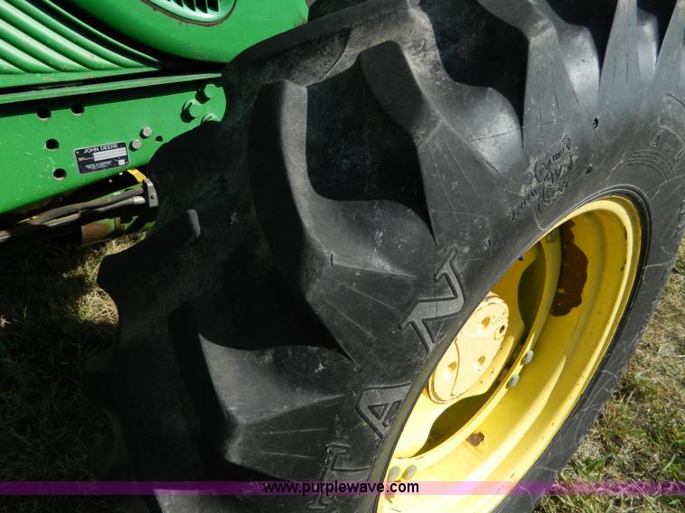 image for item H2399 2002 John Deere 6320 MFWD tractor