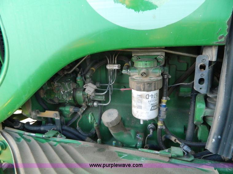 image for item H2399 2002 John Deere 6320 MFWD tractor