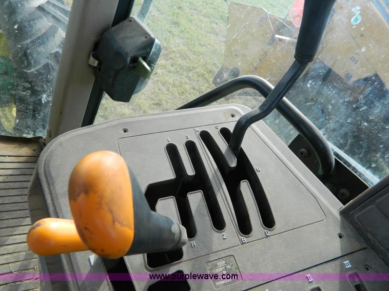 image for item H2399 2002 John Deere 6320 MFWD tractor