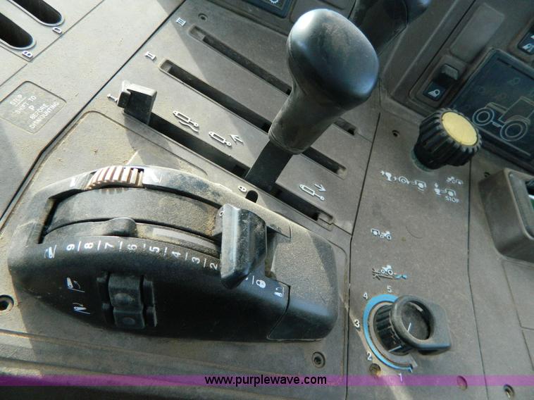 image for item H2399 2002 John Deere 6320 MFWD tractor