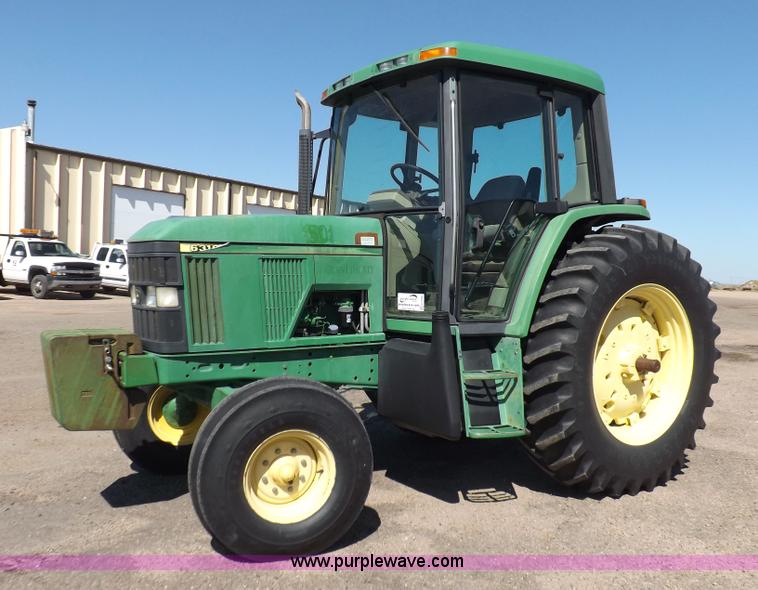 image for item H9096 1998 John Deere 6310 tractor