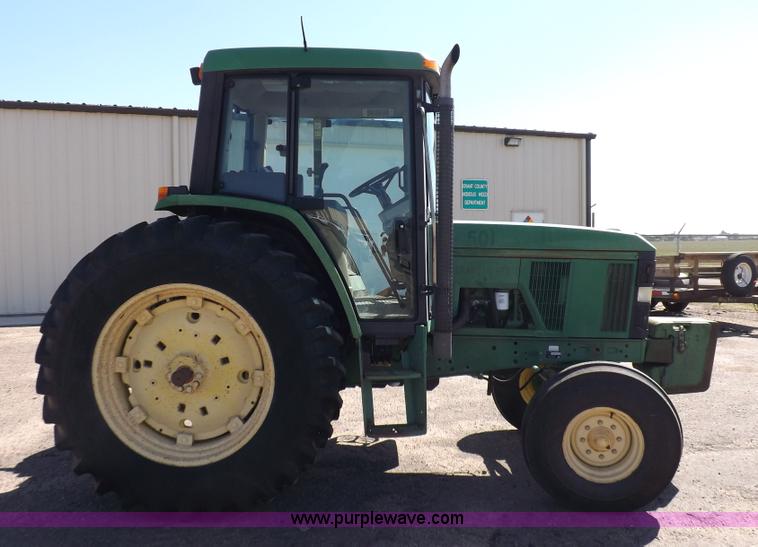 image for item H9096 1998 John Deere 6310 tractor