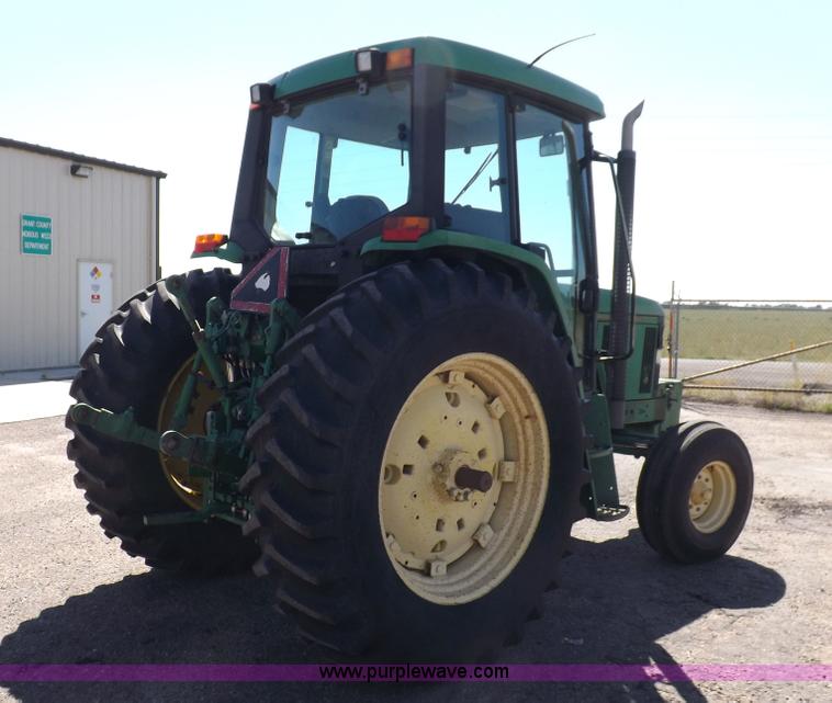 image for item H9096 1998 John Deere 6310 tractor