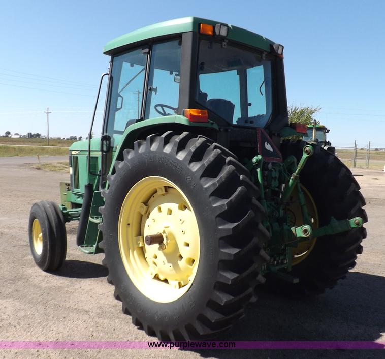 image for item H9096 1998 John Deere 6310 tractor