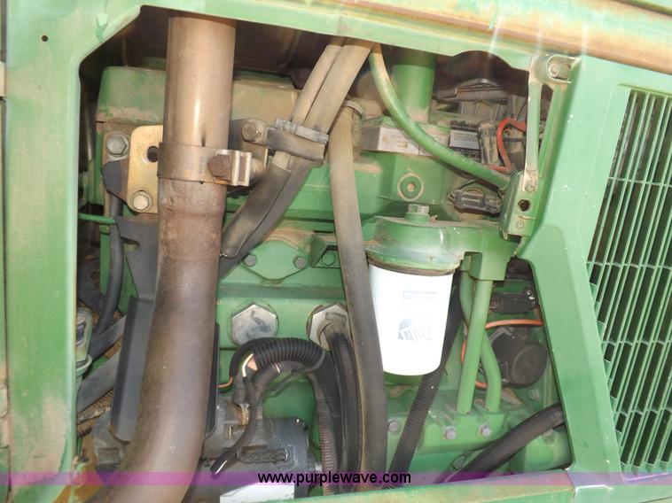 image for item H9096 1998 John Deere 6310 tractor