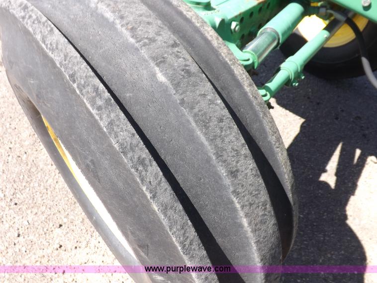 image for item H9096 1998 John Deere 6310 tractor