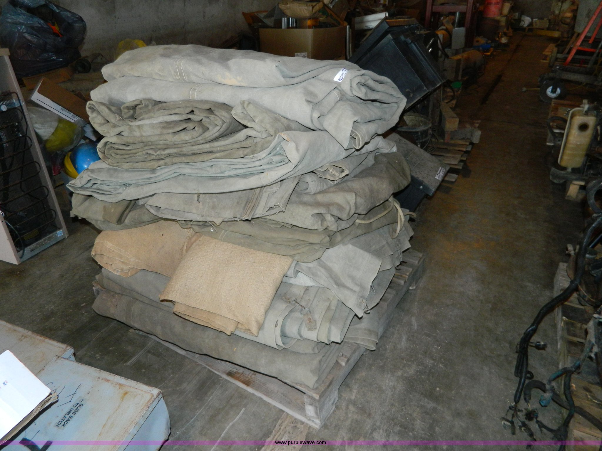 Assorted canvas tarps in Salina, KS Item AX9682 sold Purple Wave