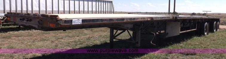 image for item H9086 2003 Transcraft TL2000F3 flatbed trailer