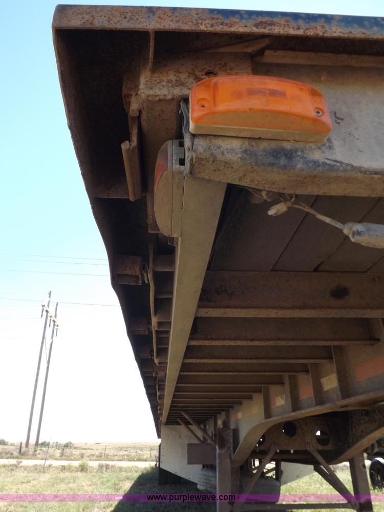 image for item H9086 2003 Transcraft TL2000F3 flatbed trailer