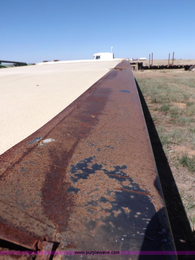 image for item H9086 2003 Transcraft TL2000F3 flatbed trailer