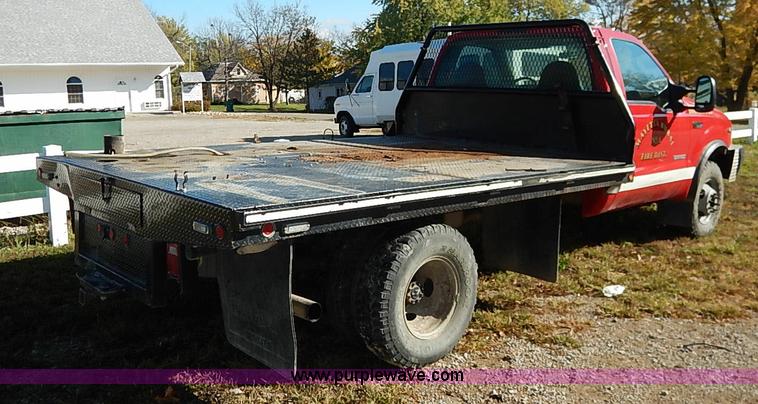 image for item I5324 2003 Ford F350 Super Duty XL flatbed pickup truck