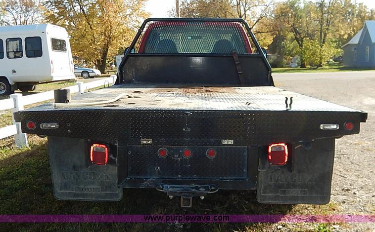 image for item I5324 2003 Ford F350 Super Duty XL flatbed pickup truck